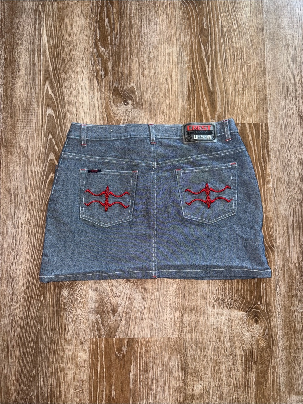 Vintage Y2K Crest Denim Mini Skirt in Washed Blue with Red Embroidery